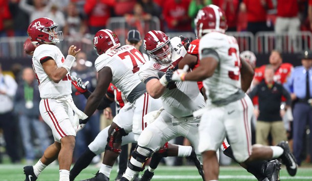 Jan 8, 2018; Atlanta, GA, USA; Alabama Crimson Tide quarterback Tua Tagovailoa (13) throws the game-winning touchdown pass to wide receiver DeVonta Smith (not pictured) in overtime against the Georgia Bulldogs in the 2018 CFP national championship college football game at Mercedes-Benz Stadium. Photo Credit: Mark J. Rebilas-USA TODAY Sports