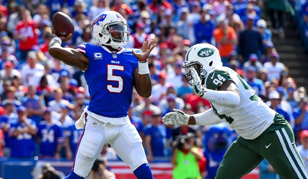Sep 10, 2017; Orchard Park, NY, USA; Buffalo Bills quarterback Tyrod Taylor (5) passes the ball as New York Jets defensive end Kony Ealy (94) pressures during the third quarter at New Era Field. Photo Credit: Rich Barnes-USA TODAY Sports