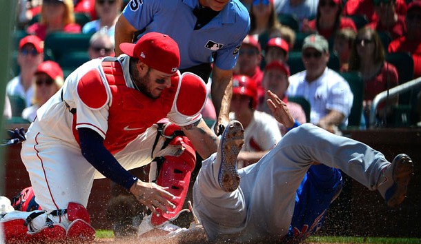 May 5, 2018; St. Louis, MO, USA; St. Louis Cardinals catcher Yadier Molina (4) is unable to tag out Chicago Cubs shortstop Addison Russell (27) during the second inning at Busch Stadium. Photo Credit: Jeff Curry-USA TODAY Sports