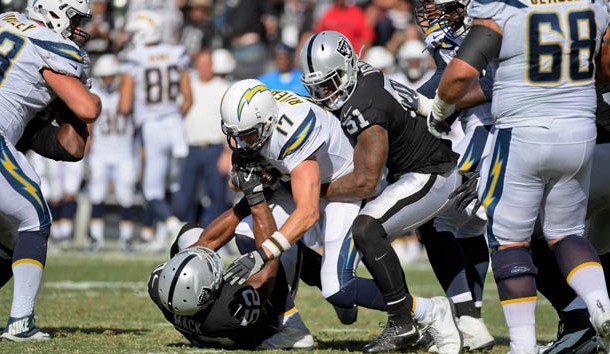 Oct 15, 2017; Oakland, CA, USA; Oakland Raiders defensive end Khalil Mack (52) sacks Los Angeles Chargers quarterback Philip Rivers (17) assisted by Raiders outside linebacker Bruce Irvin (51)during the third quarter of a NFL game at Oakland-Alameda County Coliseum. Photo Credit: Kirby Lee-USA TODAY Sports