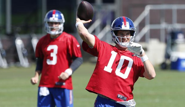 May 21, 2018; East Rutherford, NJ, USA; New York Giants quarterback Eli Manning (10) throws the ball during organized team activities at Quest Diagnostic Training Center. Photo Credit: Noah K. Murray-USA TODAY Sports