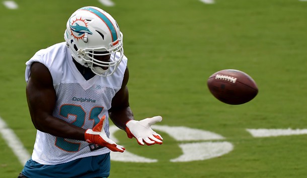 Jun 5, 2018; Davie, FL, USA; Miami Dolphins running back Frank Gore (21) during practice drills at Baptist Health Training Facility. Mandatory Credit: Steve Mitchell-USA TODAY Sports