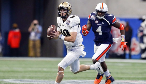 Jan 1, 2018; Atlanta, GA, USA; Central Florida Knights quarterback McKenzie Milton (10) throws a pass against the Auburn Tigers in the third quarter in the 2018 Peach Bowl at Mercedes-Benz Stadium. Photo Credit: Brett Davis-USA TODAY Sports