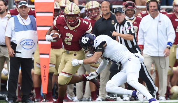 Sep 8, 2018; Chestnut Hill, MA, USA; Holy Cross Crusaders defensive back Chris Riley (7) tries to tackle Boston College Eagles running back AJ Dillon (2) during the first half at Alumni Stadium. Photo Credit: Bob DeChiara-USA TODAY Sports