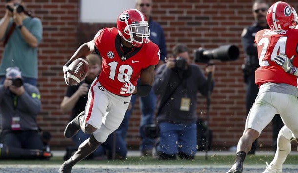 Nov 25, 2017; Atlanta, GA, USA; Georgia Bulldogs defensive back Deandre Baker (18) returns an interception against the Georgia Tech Yellow Jackets in the third quarter at Bobby Dodd Stadium. Photo Credit: Brett Davis-USA TODAY Sports