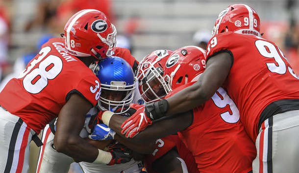 Sep 15, 2018; Athens, GA, USA; Middle Tennessee Blue Raiders running back Landon Board (17) is gang tackled by Georgia Bulldogs defenders including linebacker Azeez Ojulari (38) and defensive lineman Devonte Wyatt (95) during the second half at Sanford Stadium. Photo Credit: Dale Zanine-USA TODAY Sports