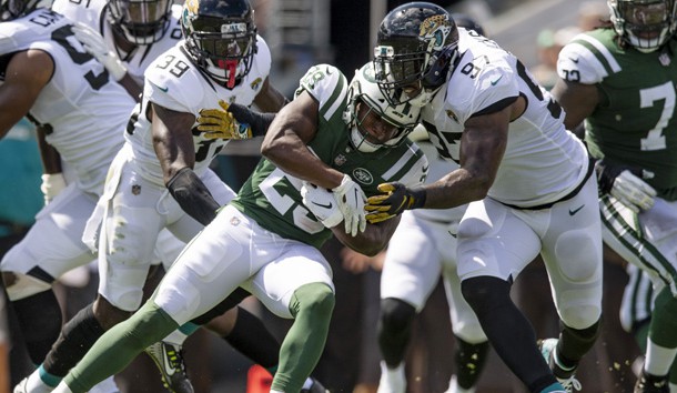 Sep 30, 2018; Jacksonville, FL, USA; New York Jets running back Bilal Powell (29) is tackled by Jacksonville Jaguars defensive tackle Malik Jackson (97) during the first half at TIAA Bank Field. Photo Credit: Douglas DeFelice-USA TODAY Sports