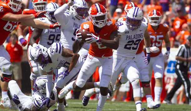 Sep 1, 2018; Clemson, SC, USA; Clemson Tigers wide receiver Justyn Ross (8) carries the ball for a touchdown while being defended by Furman Paladins linebacker Jordan Willis (30) and safety DiMarcus Clay (20) during the third quarter at Clemson Memorial Stadium. Photo Credit: Joshua S. Kelly-USA TODAY Sports