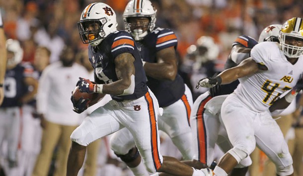 Sep 8, 2018; Auburn, AL, USA; Auburn Tigers running back Kam Martin (9) carries against the  Alabama State Hornets during the first quarter at Jordan-Hare Stadium. Photo Credit: John Reed-USA TODAY Sports