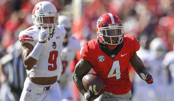 Sep 1, 2018; Athens, GA, USA; Georgia Bulldogs wide receiver Mecole Hardman (4) runs past Austin Peay Governors defensive back Trent Taylor (9) for a touchdown during the first half at Sanford Stadium. Photo Credit: Dale Zanine-USA TODAY Sports