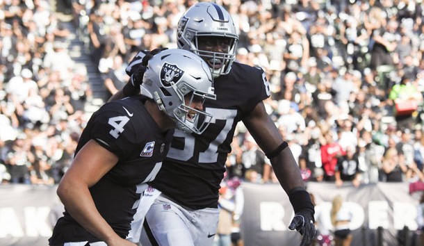 Oct 28, 2018; Oakland, CA, USA; Oakland Raiders quarterback Derek Carr (4) celebrates with tight end Jared Cook (87) after Cook's touchdown against the Indianapolis Colts during the second quarter at Oakland Coliseum. Photo Credit: Kelley L Cox-USA TODAY Sports