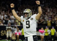 Saints rout Redskins on Brees' passing record night