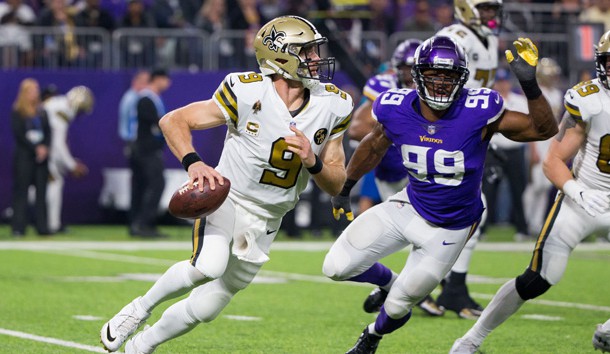 Oct 28, 2018; Minneapolis, MN, USA; New Orleans Saints quarterback Drew Brees (9) scrambles out of the pocket in the third quarter against Minnesota Vikings defensive lineman Danielle Hunter (99) at U.S. Bank Stadium. Photo Credit: Brad Rempel-USA TODAY Sports