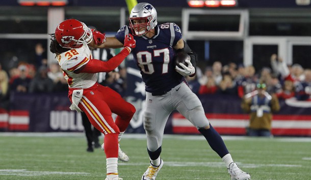 Oct 14, 2018; Foxborough, MA, USA; New England Patriots tight end Rob Gronkowski (87) makes a catch and stiff arms Kansas City Chiefs free safety Ron Parker (38) in the second half at Gillette Stadium. The Patriots defeated Kansas City 43-40. Photo Credit: David Butler II-USA TODAY Sports