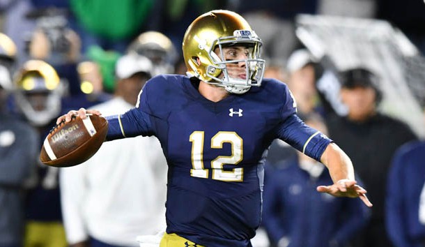 Sep 29, 2018; South Bend, IN, USA; Notre Dame Fighting Irish quarterback Ian Book (12) throws for a touchdown in the second quarter against the Stanford Cardinal at Notre Dame Stadium. Photo Credit: Matt Cashore-USA TODAY Sports
