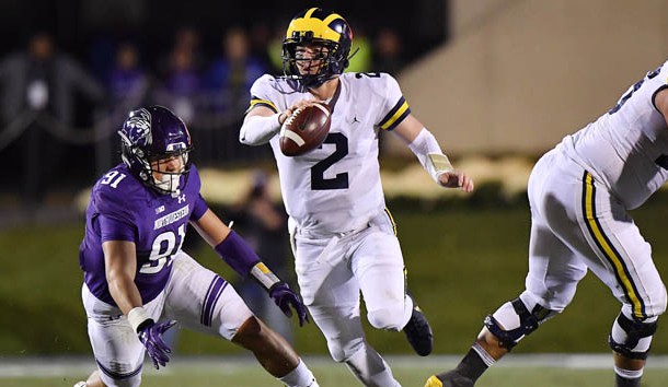 Sep 29, 2018; Evanston, IL, USA; Michigan Wolverines quarterback Shea Patterson (2) scrambles with the ball against Northwestern Wildcats defensive lineman Samdup Miller (91) at Ryan Field. Photo Credit: Quinn Harris-USA TODAY Sports
