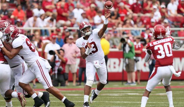 Oct 6, 2018; Fayetteville, AR, USA; Alabama Crimson Tide quarterback Too Tagovailoa (13) passes for a touchdown against the Arkansas Razorbacks in the first half at Donald W. Reynolds Razorback Stadium. Photo Credit: Nelson Chenault-USA TODAY Sports