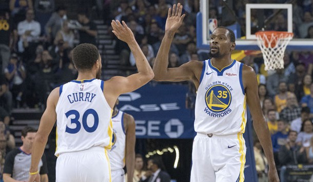 October 8, 2018; Oakland, CA, USA; Golden State Warriors forward Kevin Durant (35) and guard Stephen Curry (30) celebrate against the Phoenix Suns during the first quarter at Oracle Arena. Photo Credit: Kyle Terada-USA TODAY Sports