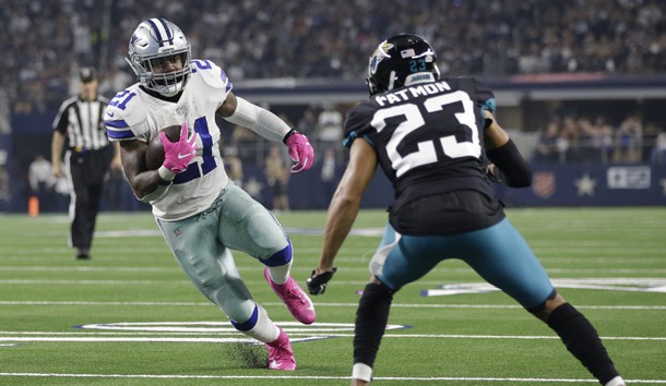 Oct 14, 2018; Arlington, TX, USA; Dallas Cowboys running back Ezekiel Elliott (21) runs for a touchdown in the fourth quarter against Jacksonville Jaguars defensive back Tyler Patmon (23) at AT&T Stadium. Photo Credit: Tim Heitman-USA TODAY Sports