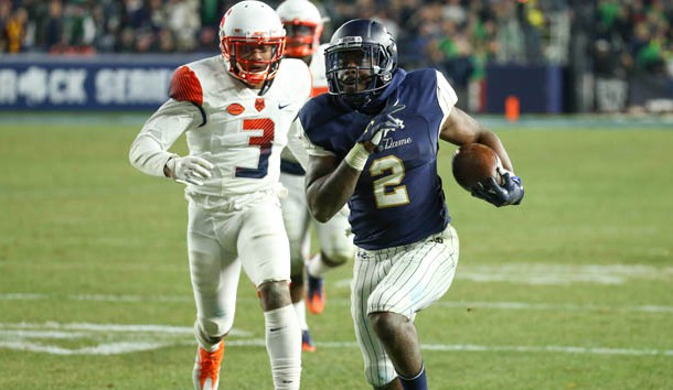 Nov 17, 2018; New York, NY, USA; Notre Dame Fighting Irish running back Dexter Williams (2) runs with the ball past Syracuse Orange defensive back Christopher Fredrick (3) during the fourth quarter at Yankee Stadium. Photo Credit: Rich Barnes-USA TODAY Sports