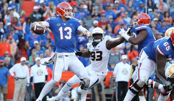 Nov 3, 2018; Gainesville, FL, USA; Florida Gators quarterback Feleipe Franks (13) throws the ball as Missouri Tigers defensive lineman Tre Williams (93) defends during the second half at Ben Hill Griffin Stadium. Photo Credit: Kim Klement-USA TODAY Sports