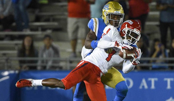 Sep 15, 2018; Pasadena, CA, USA; Fresno State Bulldogs wide receiver Jamire Jordan (1) makes a leaping catch on front of UCLA Bruins defensive back Darnay Holmes (1) in the third quarter at Rose Bowl. Photo Credit: Robert Hanashiro-USA TODAY Sports