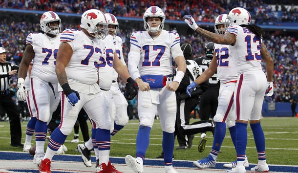 Nov 25, 2018; Orchard Park, NY, USA; Buffalo Bills quarterback Josh Allen (17) celebrates his touchdown with offensive tackle Dion Dawkins (73) and wide receiver Kelvin Benjamin (13) during the second half against the Jacksonville Jaguars at New Era Field. Photo Credit: Timothy T. Ludwig-USA TODAY Sports