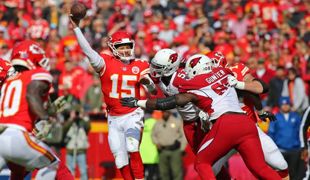 Nov 11, 2018; Kansas City, MO, USA; Kansas City Chiefs quarterback Patrick Mahomes (15) throws a pass as Arizona Cardinals linebacker Josh Bynes (57) and defensive tackle Rodney Gunter (95) defend in the first half at Arrowhead Stadium. Photo Credit: Jay Biggerstaff-USA TODAY Sports