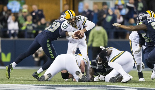 Nov 15, 2018; Seattle, WA, USA; Green Bay Packers quarterback Aaron Rodgers (12) is sacked by Seattle Seahawks linebacker Jake Martin (59) during the second half at CenturyLink Field. Seattle defeated Green Bay 27-24. Photo Credit: Steven Bisig-USA TODAY Sports