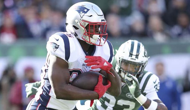Nov 25, 2018; East Rutherford, NJ, USA; New England Patriots running back Sony Michel (26) runs the ball against New York Jets safety Jamal Adams (33) during the first quarter at MetLife Stadium. Photo Credit: Brad Penner-USA TODAY Sports
