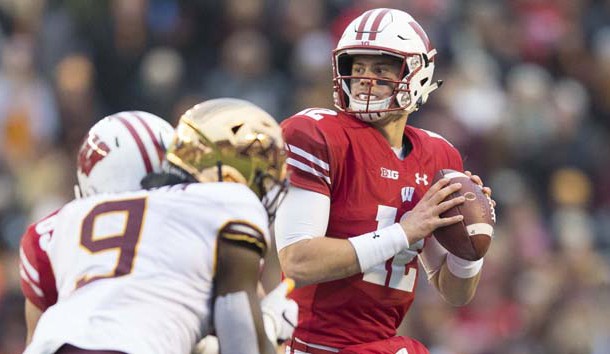 Nov 24, 2018; Madison, WI, USA; Wisconsin Badgers quarterback Alex Hornibrook (12) looks to pass the football during the second quarter against the Minnesota Golden Gophers at Camp Randall Stadium. Photo Credit: Jeff Hanisch-USA TODAY Sports