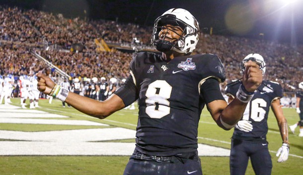 Dec 1, 2018; Orlando, FL, USA; UCF Knights quarterback Darriel Mack Jr. (8) celebrates after a touchdown during the second half against the Memphis Tigers at Spectrum Stadium. Photo Credit: Reinhold Matay-USA TODAY Sports