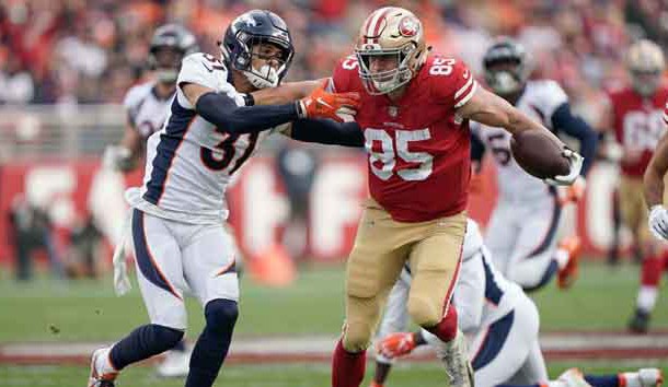 Dec 9, 2018; Santa Clara, CA, USA; San Francisco 49ers tight end George Kittle (85) stiff arms Denver Broncos free safety Justin Simmons (31) during the second quarter at Levi's Stadium. Photo Credit: Stan Szeto-USA TODAY Sports