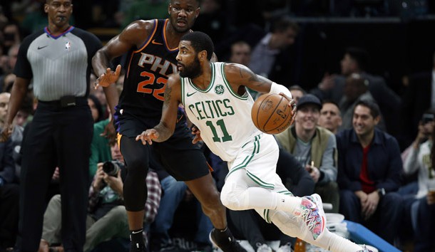 Dec 19, 2018; Boston, MA, USA; Boston Celtics guard Kyrie Irving (11) drives past Phoenix Suns center Deandre Ayton (22) during the first quarter at TD Garden. Photo Credit: Winslow Townson-USA TODAY Sports