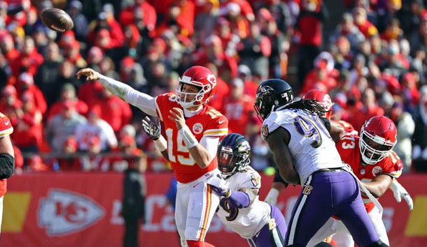 Dec 9, 2018; Kansas City, MO, USA; Kansas City Chiefs quarterback Patrick Mahomes (15) throws as he is hit by Baltimore Ravens linebacker Matthew Judon (99) in the first half at Arrowhead Stadium. Photo Credit: Jay Biggerstaff-USA TODAY Sports