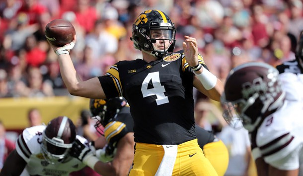 Jan 1, 2019; Tampa, FL, USA; Iowa Hawkeyes quarterback Nate Stanley (4) throws the ball against the Mississippi State Bulldogs during the second quarter in the 2019 Outback Bowl at Raymond James Stadium. Photo Credit: Kim Klement-USA TODAY Sports