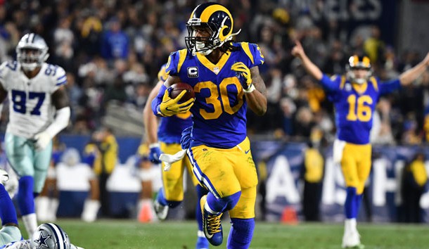 Jan 12, 2019; Los Angeles, CA, USA; Los Angeles Rams running back Todd Gurley (30) runs in a touchdown in the second quarter against Dallas Cowboys cornerback Chidobe Awuzie (24) in a NFC Divisional playoff football game at Los Angeles Memorial Coliseum. Photo Credit: Robert Hanashiro-USA TODAY Sports