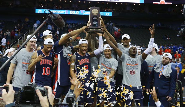 Mar 31, 2019; Kansas City, MO, United States; Auburn Tigers players celebrate with the trophy after defeating the Kentucky Wildcats in the championship game of the midwest regional of the 2019 NCAA Tournament at Sprint Center. Photo Credit: Jay Biggerstaff-USA TODAY Sports