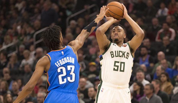 Apr 10, 2019; Milwaukee, WI, USA; Milwaukee Bucks forward Bonzie Colson (50) shoots the ball over Oklahoma City Thunder guard Terrance Ferguson (23) during the first quarter at Fiserv Forum. Photo Credit: Jeff Hanisch-USA TODAY Sports