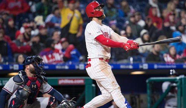 Mar 31, 2019; Philadelphia, PA, USA; Philadelphia Phillies right fielder Bryce Harper (3) hits a home run in front of Atlanta Braves catcher Brian McCann (16) during the seventh inning at Citizens Bank Park. Photo Credit: Bill Streicher-USA TODAY Sports
