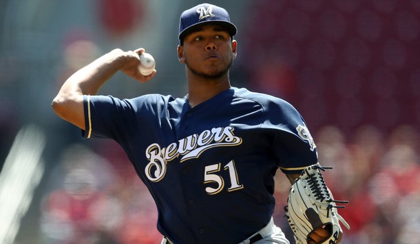 Apr 3, 2019; Cincinnati, OH, USA; Milwaukee Brewers starting pitcher Freddy Peralta (51) throws the ball against the Cincinnati Reds in the first inning at Great American Ball Park. Photo Credit: Aaron Doster-USA TODAY Sports