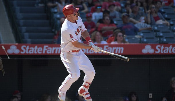 Apr 7, 2019; Anaheim, CA, USA; Los Angeles Angels center fielder Mike Trout (27) follows through on a two run home run in the fifth inning against the Texas Rangers at Angel Stadium of Anaheim. Photo Credit: Kirby Lee-USA TODAY Sports