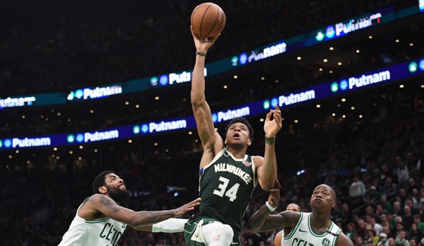 May 3, 2019; Boston, MA, USA; Milwaukee Bucks forward Giannis Antetokounmpo (34) drives to the basket against Boston Celtics guard Kyrie Irving (11) and guard Terry Rozier (12) during the second half in game three of the second round of the 2019 NBA Playoffs at TD Garden. Photo Credit: Bob DeChiara-USA TODAY Sports