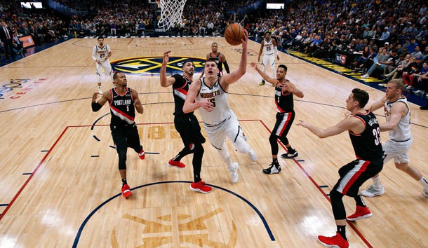 Apr 29, 2019; Denver, CO, USA; Denver Nuggets center Nikola Jokic (15) shoots the ball past Portland Trail Blazers guard Rodney Hood (5), center Enes Kanter (00), guard CJ McCollum (3) and forward Zach Collins (33) in front of Nuggets forward Mason Plumlee (24) in the third quarter in game one of the second round of the 2019 NBA Playoffs at the Pepsi Center. Mandatory Credit: Isaiah J. Downing-USA TODAY Sports