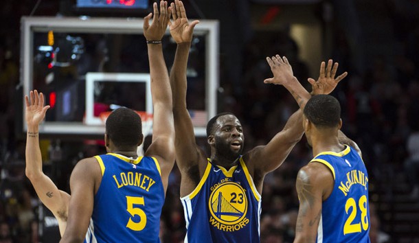 May 18, 2019; Portland, OR, USA; Golden State Warriors forward Draymond Green (23) gives high-fives to teammates center Kevon Looney (5) and forward Alfonzo McKinnie (28) during the second half in game three of the Western conference finals of the 2019 NBA Playoffs at Moda Center. The Golden State Warriors beat the Portland Trail Blazers 110-99. Photo Credit: Troy Wayrynen-USA TODAY Sports