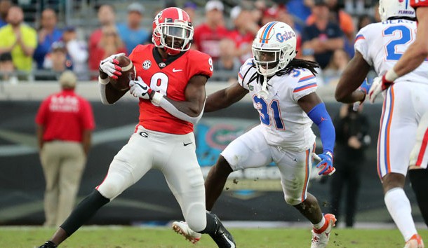 Oct 27, 2018; Jacksonville, FL, USA; Georgia Bulldogs wide receiver Jeremiah Holloman (9) catches the ball against Florida Gators defensive back Shawn Davis (31) during the second half at TIAA Bank Field. Photo Credit: Kim Klement-USA TODAY Sports