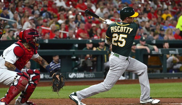 Jun 25, 2019; St. Louis, MO, USA; Oakland Athletics right fielder Stephen Piscotty (25) hits a one run single off of St. Louis Cardinals starting pitcher Jack Flaherty (22) during the fifth inning at Busch Stadium. Photo Credit: Jeff Curry-USA TODAY Sports