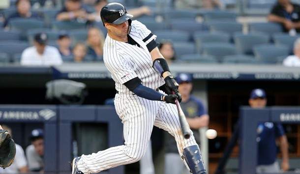 Jul 18, 2019; Bronx, NY, USA; New York Yankees catcher Gary Sanchez (24) hits an RBI single against the Tampa Bay Rays during the fifth inning of the first game of a doubleheader at Yankee Stadium. Photo Credit: Brad Penner-USA TODAY Sports