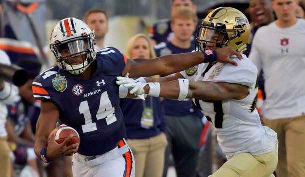 Dec 28, 2018; Nashville, TN, USA; Auburn Tigers quarterback Malik Willis (14) rushes against the Purdue Boilermakers during the second half of the 2018 Music City Bowl at Nissan Stadium. Auburn won 63-14. Mandatory Credit: Jim Brown-USA TODAY Sports