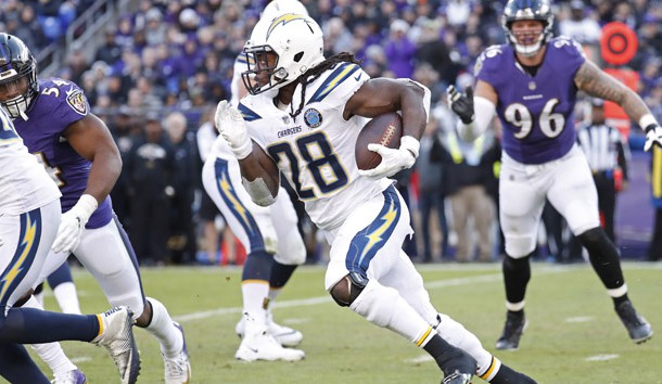 Jan 6, 2019; Baltimore, MD, USA; Los Angeles Chargers running back Melvin Gordon (28) carries the ball past Baltimore Ravens defensive end Brent Urban (96) in the third quarter in a AFC Wild Card playoff football game at M&T Bank Stadium. The Chargers won 23-17. Photo Credit: Geoff Burke-USA TODAY Sports